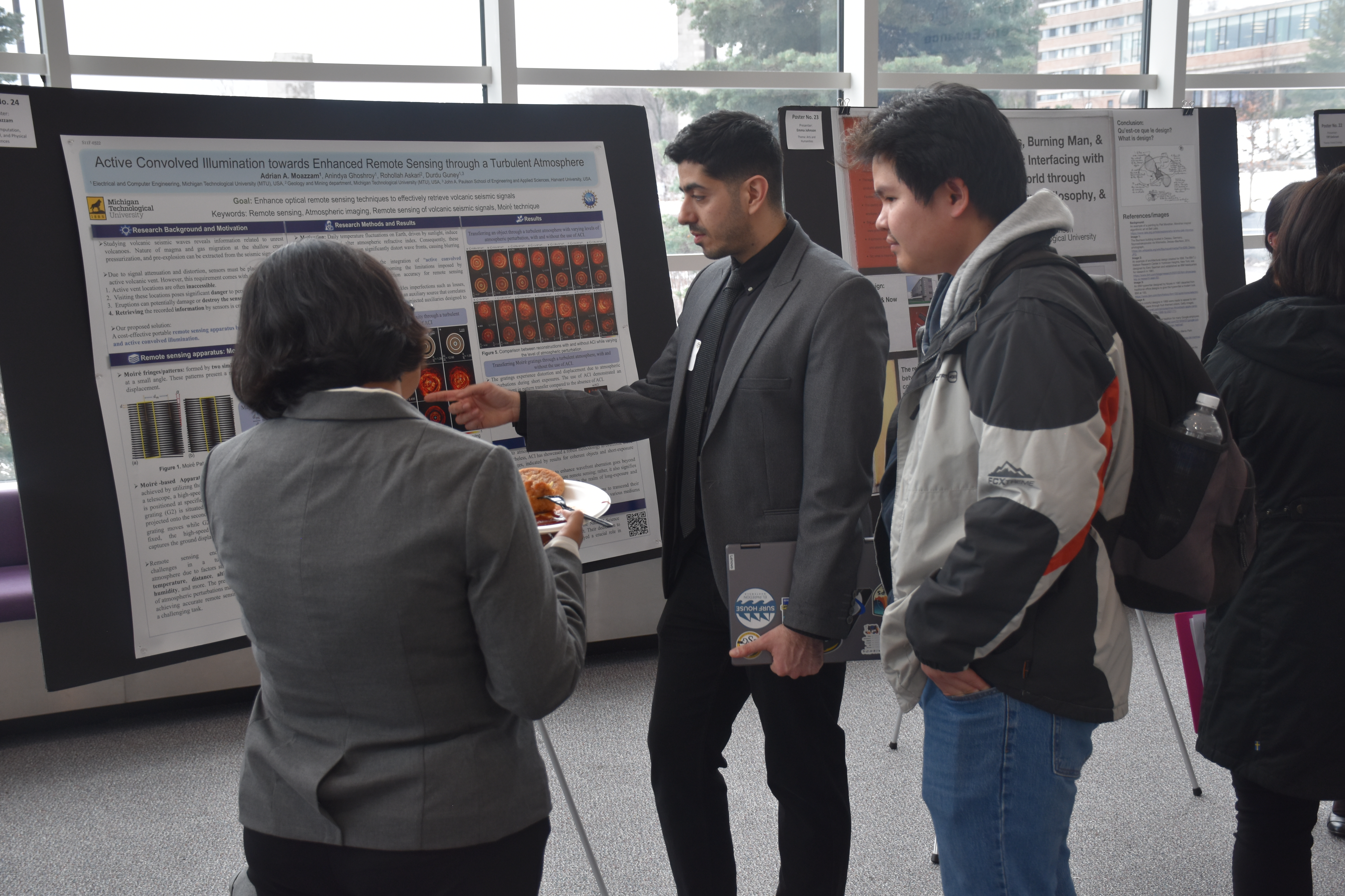 Adrian Moazzam presenting research at a poster session